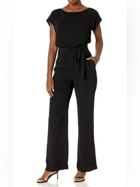 Eliza J. Black Tie-Waist Jumpsuit - Elegant Wide-Leg, Boatneck. Pockets.